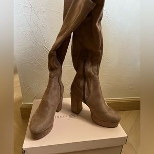 suede tan boots, worn twice. 4 Inch heel, 1 inch platform. Side zipper.
